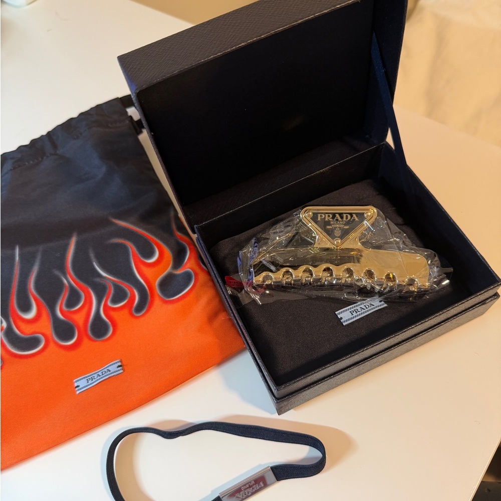 Prada Gold Hair Clip with Orange Flame Pouch